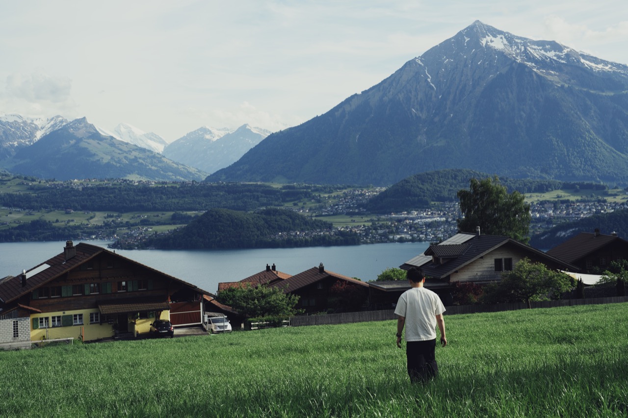 A wide mountain travel portrait overlooking a lake